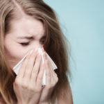 woman sneezing